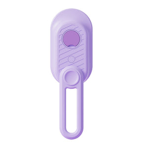 A white electric hairbrush with a hanging loop handle, featuring a circular gold-toned power button with a water droplet icon on the front.